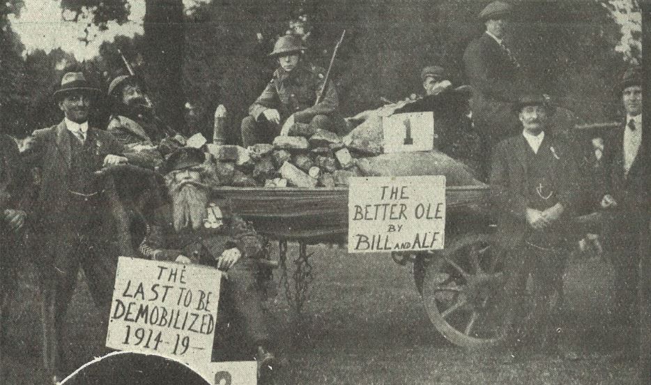 The National Federation of Discharged and Demobilized Sailors and Soldiers' decorated car,<br>which took first prize for its depiction of 'The Better 'Ole', from the WW1 cartoon caption:<br>(two soldiers in a bomb-hole) 'Well, if you knows of a better 'ole', go for it.'<br><small><i>Cheltenham Chronicle and Gloucestershire Graphic</i> 6 September 1919</small>