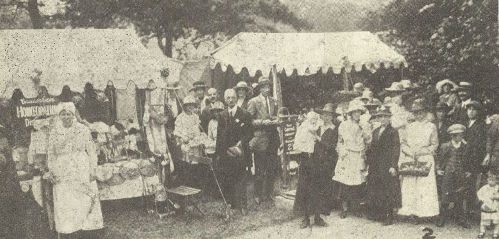 Two stalls and assorted bystanders<br><small><i>Cheltenham Chronicle and Gloucestershire Graphic</i> 17 July 1920</small>